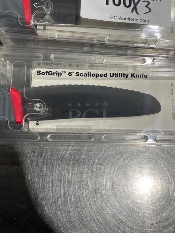 Brand new Don SofGrip 6" scalloped utility knife, stainless steel, model 1141930, gray grip handle, in packaging.
