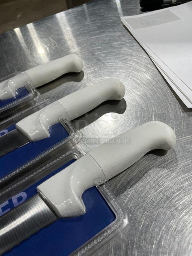 Brand new Crestware KN51 10" ham slicer with serrated blade and white grip handle, packaged, German steel.