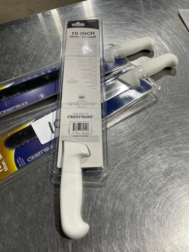 Brand new Crestware KN51 10" serrated ham slicer with white grip handle, in packaging. German steel, NSF certified.