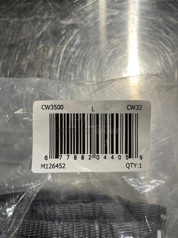 Brand new Chefwear CW32 gray chef pants in packaging, size large, with barcode label CW3500, indicating product details.