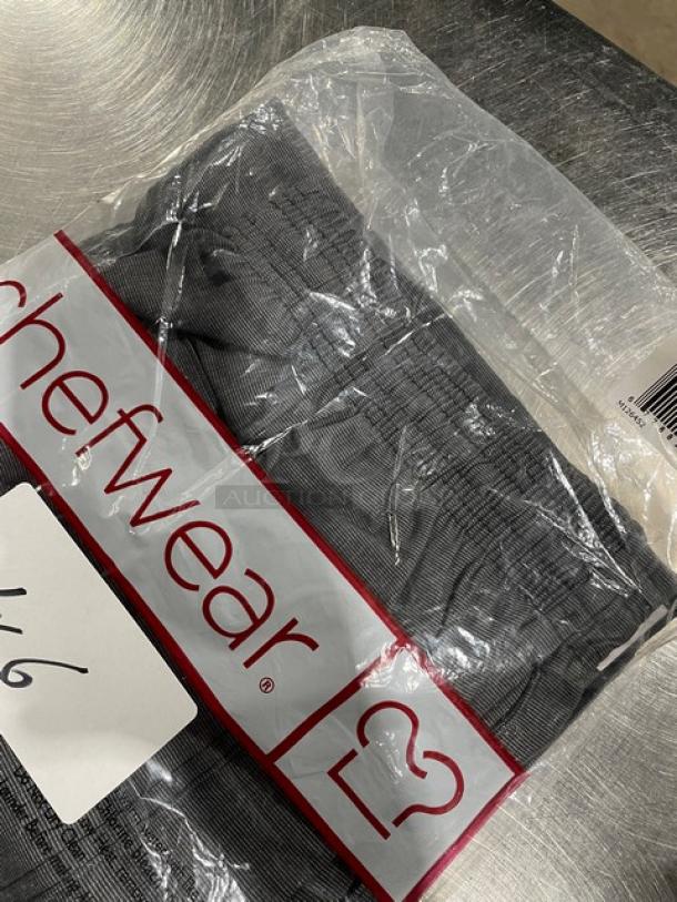 Brand new Chefwear CW32 gray chef pants in packaging, size 4X, featuring a commercial-grade design.