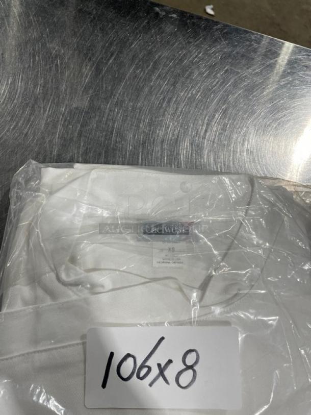 Brand new Chefwear white XS-size snap chef jacket, model 562040XS, in original packaging with tags.