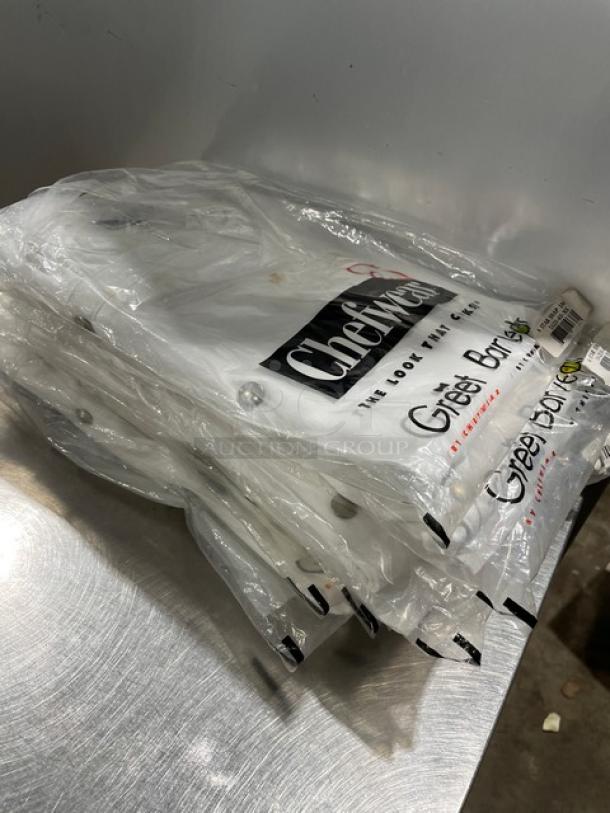 Brand new Chefwear white XS-size chef jacket, model 562040XS, in packaging. Snap closure, commercial quality.