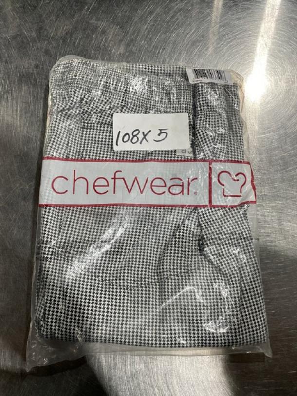 Brand new Chefwear CW11 3X-size chef pants, sealed in clear packaging. Includes visible branding and size labels.