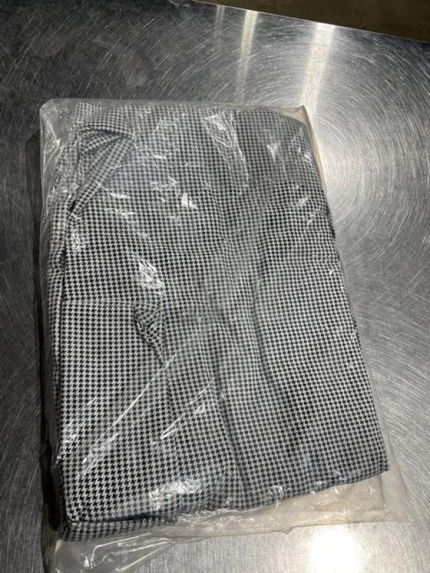 Brand new Chefwear XL chef pants, model CW11, in plastic packaging. Black and white houndstooth pattern.