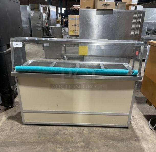 Atlas Metal stainless steel 4-well steamtable with sneeze guard and tray slide, 208V, on casters, commercial use.