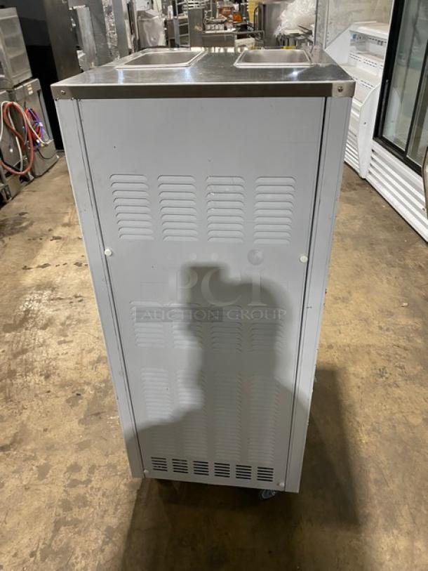 2024 commercial stainless steel twin/twist soft serve ice cream machine, Model XY-25L, on casters, 110V, viewed from the side.