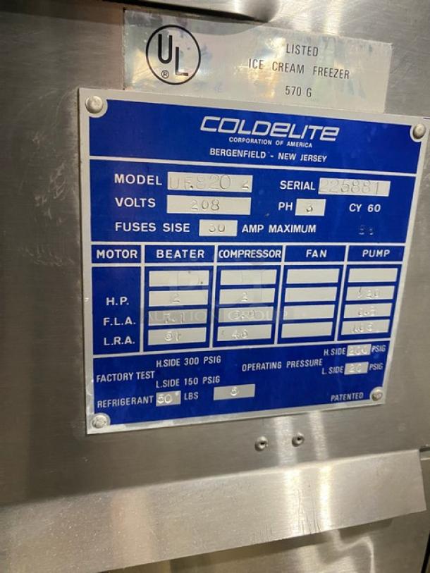 ColdElite UF820-2 stainless steel soft serve machine, 208V 3 phase, on casters, model and serial tags shown.