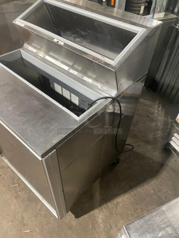 Silver King stainless steel refrigerated ice cream topping fountainette, model SKFSM/C7, 115V, on casters, good condition.