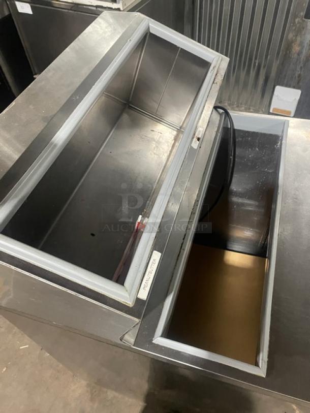Silver King stainless steel refrigerated topping fountainette, model SKFSM/C7, 115V, on casters, open lid view.