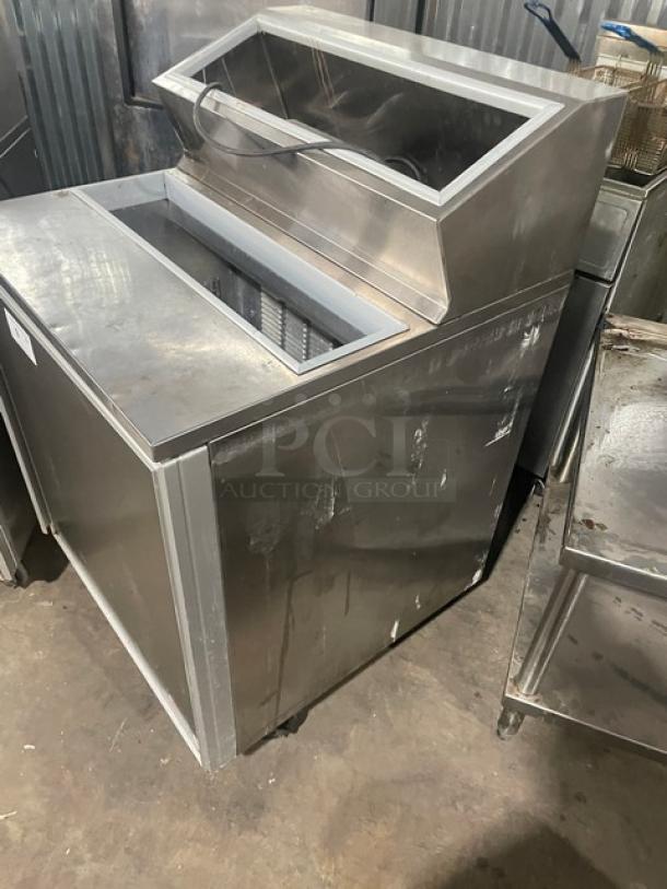 Silver King stainless steel single door refrigerated topping fountainette, model SKFSM/C7, with poly-coated racks.