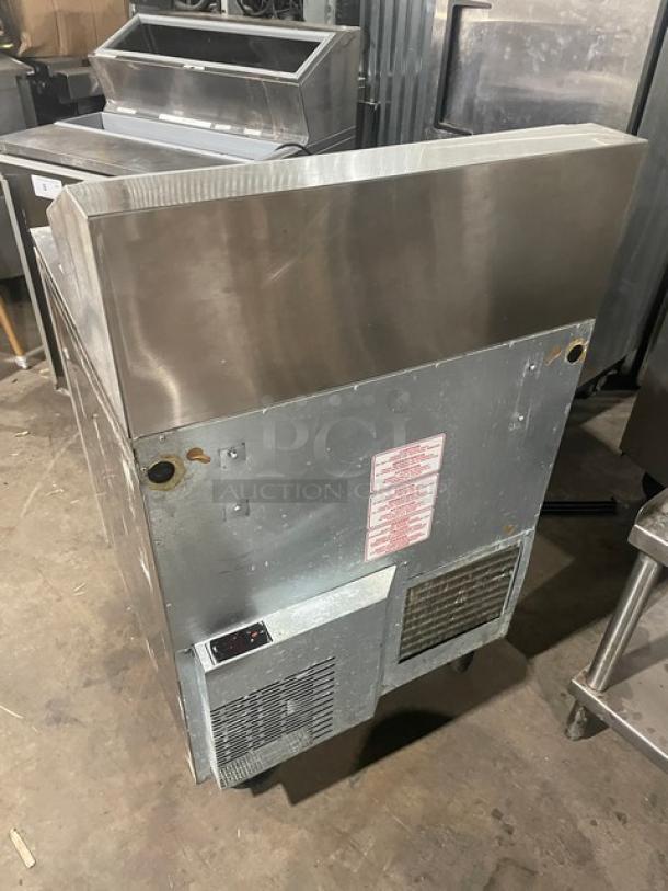 Silver King stainless steel refrigerated ice cream workstation, model SKFSM/C7, with poly-coated racks, on casters, 115V.