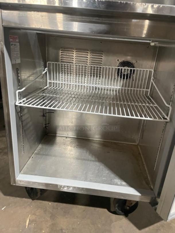 Silver King stainless steel refrigerated workstation, model SKFSM/C7, with poly-coated wire racks, on casters.