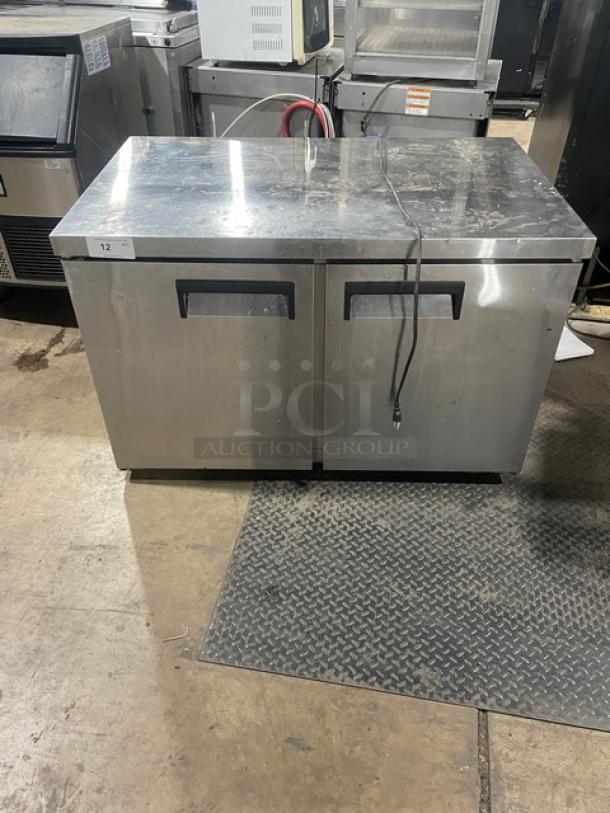 Universal Coolers commercial 2-door stainless steel undercounter refrigerator, model SC-48-LBI, with poly-coated wire racks.