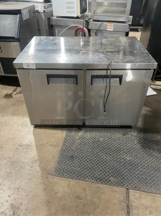 Universal Coolers commercial 2-door stainless steel undercounter refrigerator, model SC-48-LBI, with poly-coated wire racks.