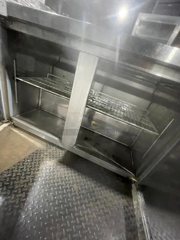 Universal Coolers 2 Door Stainless Steel Undercounter Worktop Refrigerator, Model SC48LBI, with poly-coated wire racks.