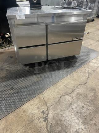 Universal Coolers 4-drawer stainless steel undercounter refrigerator with casters. Commercial-grade, excellent condition.