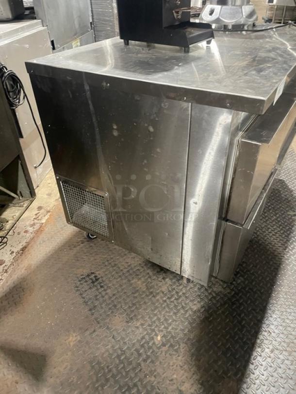 Universal Coolers stainless steel 4-drawer undercounter worktop refrigerator on casters. Used condition.