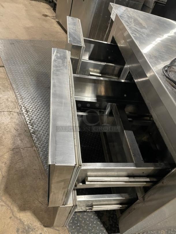 Universal Coolers stainless steel 4 drawer undercounter refrigerator on casters, shown open, excellent condition.