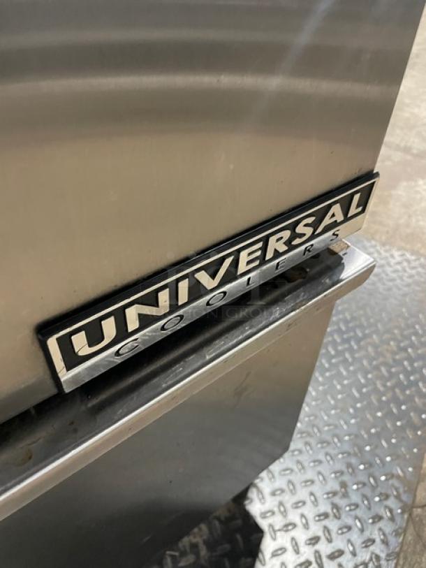 Universal Coolers stainless steel 4-drawer undercounter refrigerator on casters, showcasing brand logo plate.