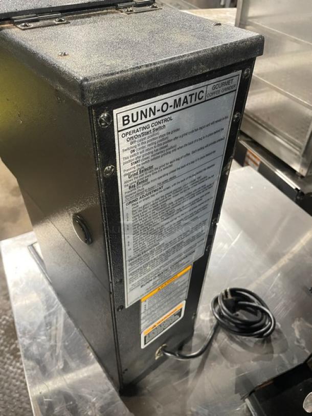 Bunn G1HD Coffee Grinder, black, commercial-grade, electric, countertop bulk espresso model, visible operating instructions.