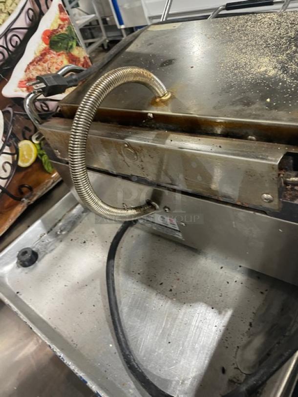 Winco EPG1C stainless steel electric panini grill with grooved grates, model EPG-1C, 120V. Used condition.