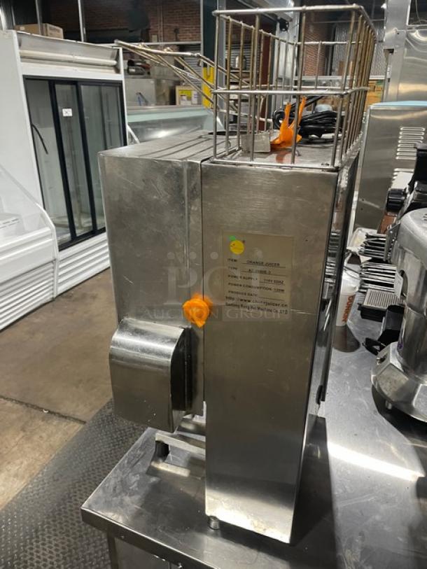 Nantong Rong stainless steel countertop orange/lemon squeezer, model XC2000E3, 110V, electric-powered, good condition.