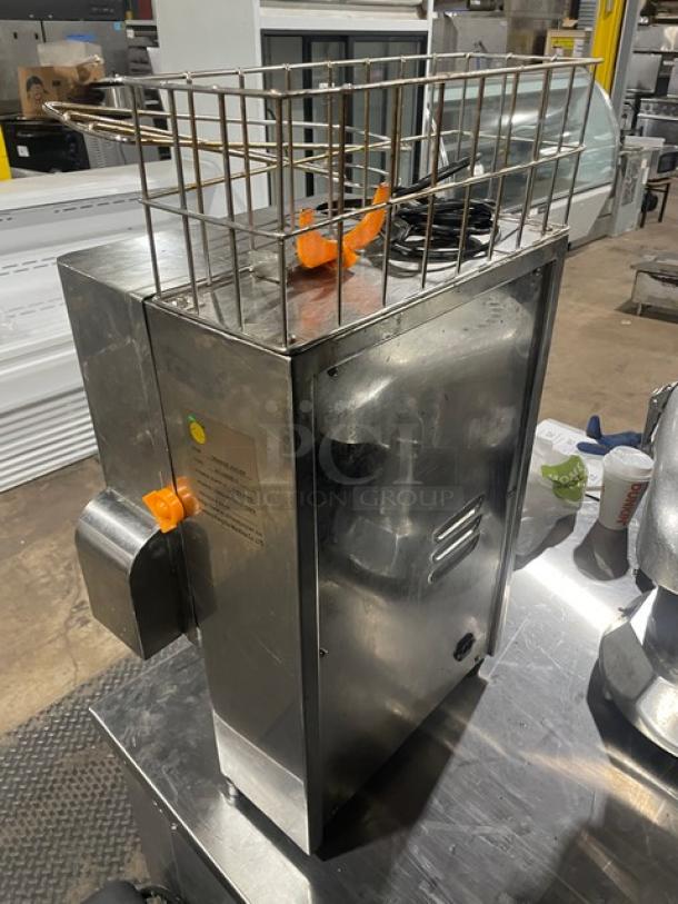 Nantong Rong stainless steel electric orange/lemon squeezer, model XC-2000E-3. Features top basket, visible label with specs.