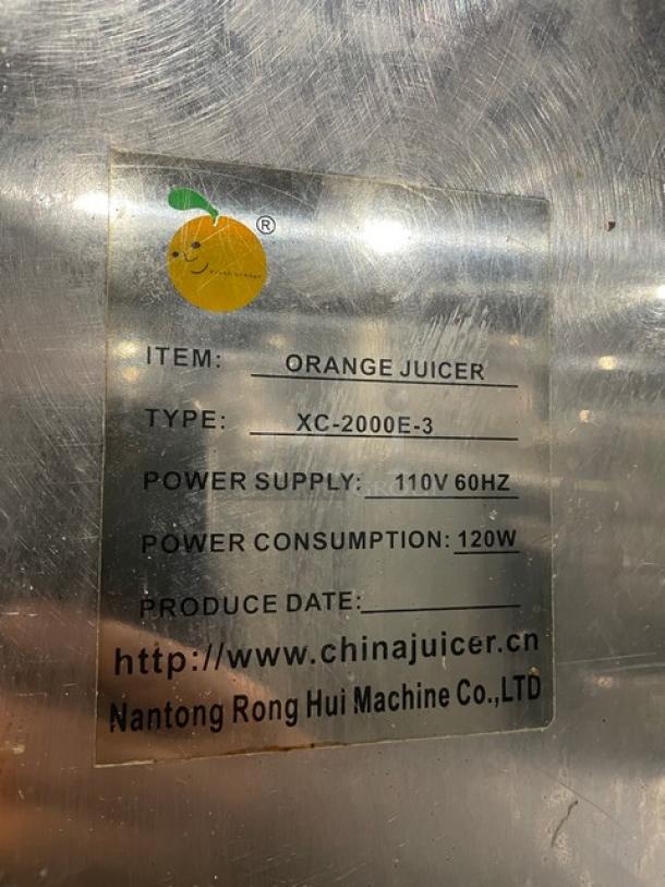 Nantong Rong XC2000E3 stainless steel electric juicer, 110V. Label specifies type, power supply, and website.