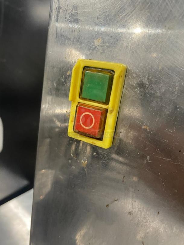 Nantong Rong XC-2000E-3 stainless steel juicer with green and red power buttons, in used condition.