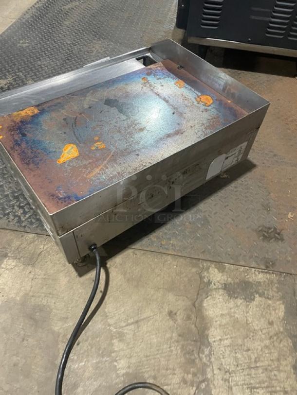 Cecilware EL1624 stainless steel electric griddle with thermostatic control. Features back and side splash. Condition shows wear.