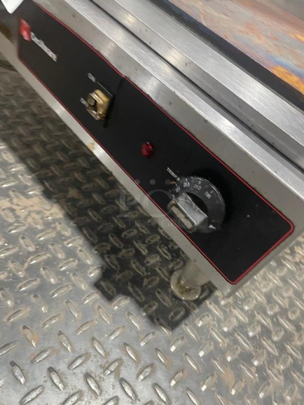 Cecilware EL1624 stainless steel electric countertop griddle with thermostatic control, back, and side splash.