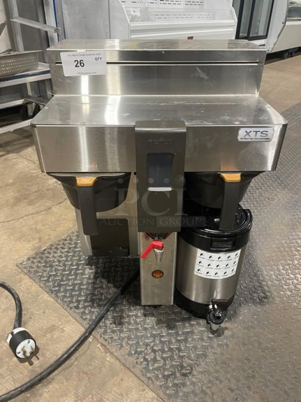 Fetco CBS-2132-XTS commercial stainless steel double coffee brewer with hot water dispenser, on legs, electric powered.
