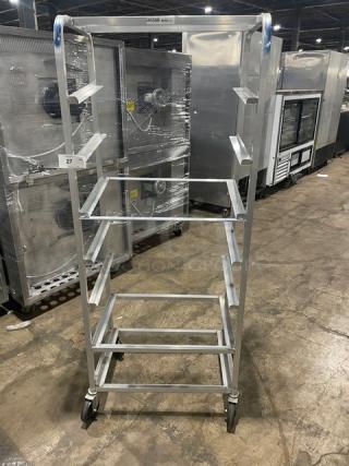 Channel Commercial Aluminum Slanted Display Rack, Model SRS-7, on casters, sturdy condition, features multiple slanted shelves.