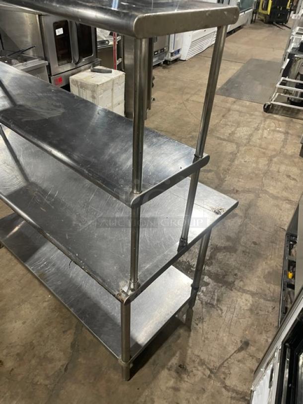 Sapphire stainless steel worktop table with single undershelf and double overhead shelf. Good condition, sturdy on legs.