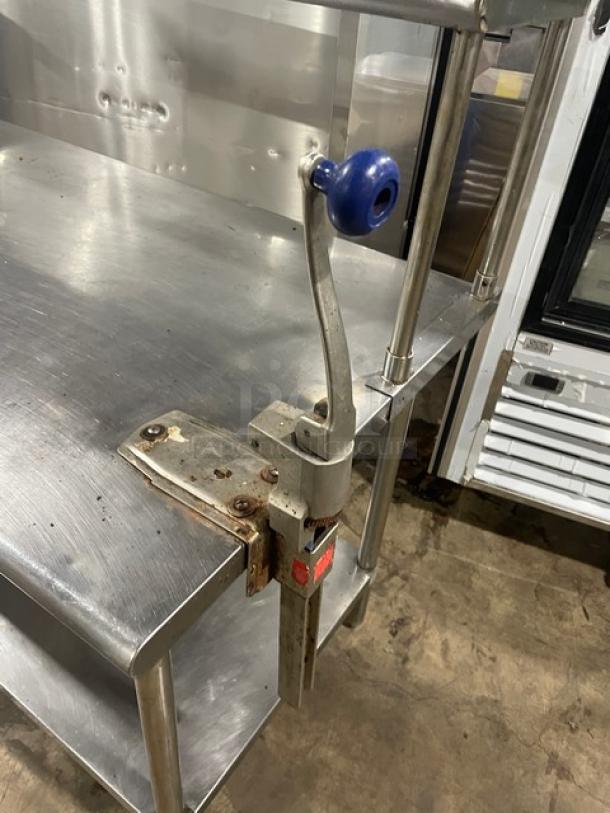 Sapphire stainless steel worktop table with double overhead shelf, Edlund manual can opener attached, sturdy legs, gently used.