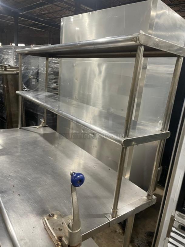 Sapphire stainless steel worktop table with undershelf and double overhead shelves, includes Edlund manual can opener, on legs.