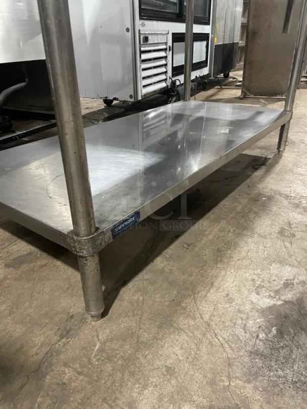 Sapphire stainless steel worktop table with a single undershelf, double overhead shelf, and Edlund manual can opener. Sturdy legs.