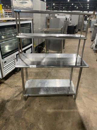 Sapphire stainless steel worktop table with single undershelf and double overhead shelf. On sturdy legs, commercial-grade condition.