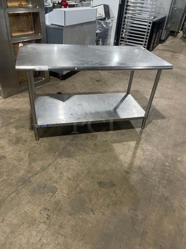 Sapphire stainless steel worktop table with undershelf on legs; commercial grade, sturdy condition, ideal for kitchen use.