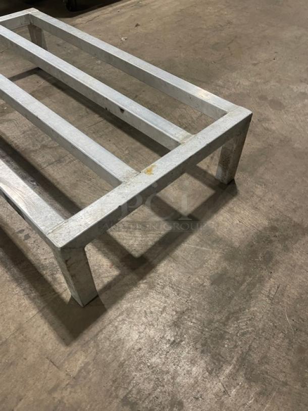 Commercial aluminum dunnage rack on legs, sturdy, excellent condition, ideal for storage and organization.