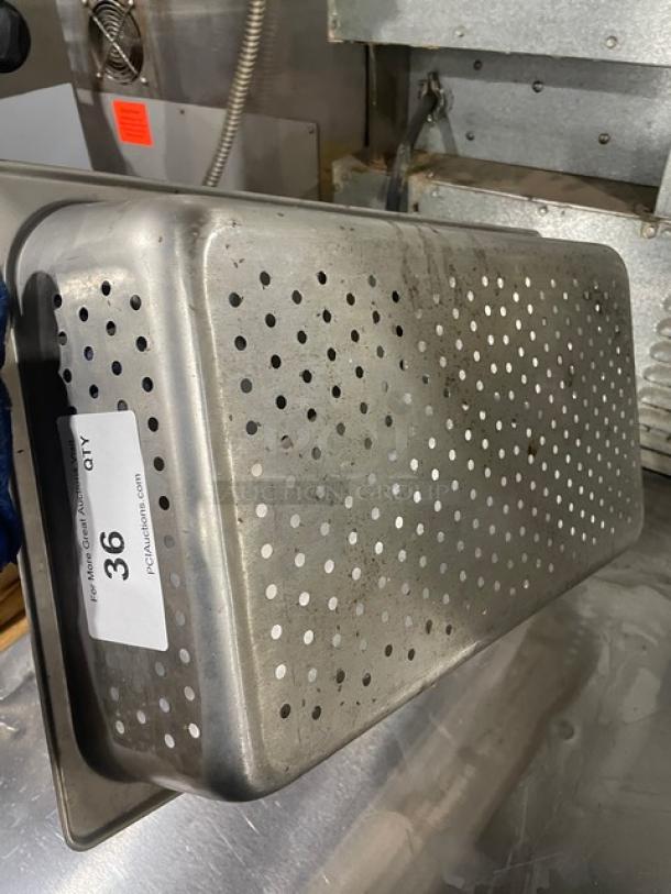 Commercial perforated stainless steel steamtable pan, used condition, item tag indicates quantity 36.