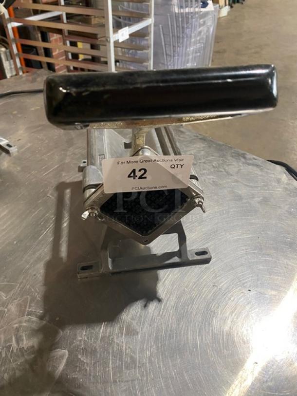 Nemco Commercial Heavy-Duty Manual French Fry Cutter, countertop design, metal construction, handle and cutting grid visible, good condition.