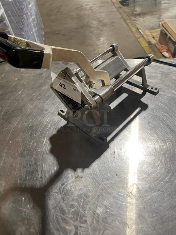 Nemco commercial heavy-duty manual countertop French fry/potato cutter. Metal construction, lever handle, appears in good condition.