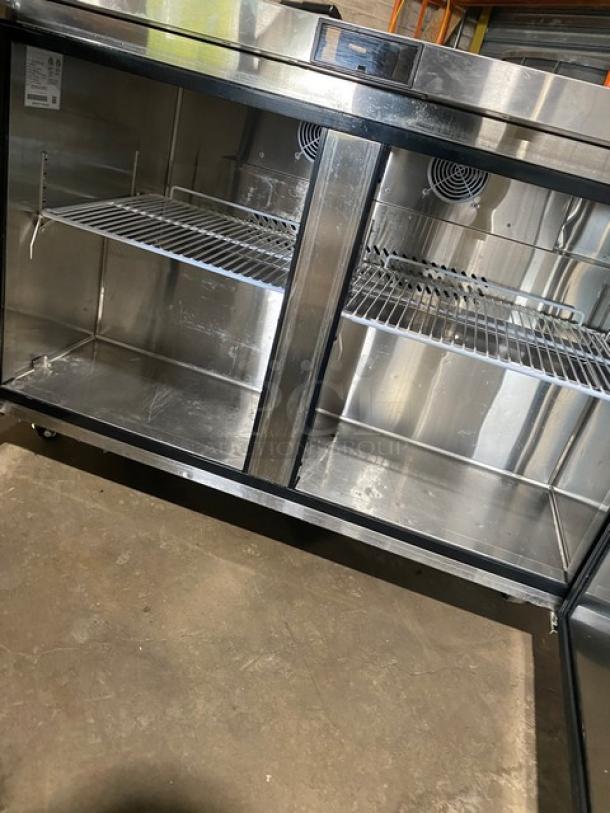Atosa MGF8406GR stainless steel 2-door undercounter worktop freezer with poly-coated racks, excellent condition, on casters.