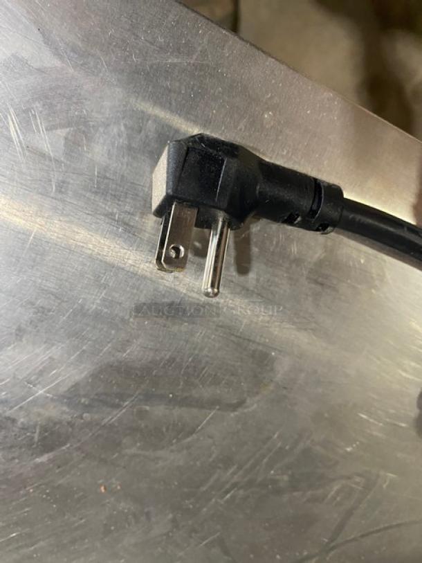 Close-up of a plug on an Atosa MGF8406GR undercounter worktop freezer, stainless steel surface visible.