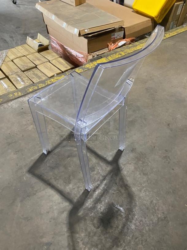 Clear stackable dining chair with legs, suitable for indoor/outdoor use. Commercial grade. Appears in excellent condition.
