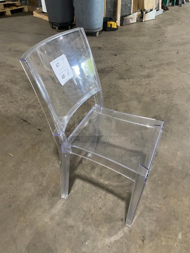 Clear stackable dining chair on legs, suitable for indoor/outdoor use. Transparent design, durable plastic, auction includes four.