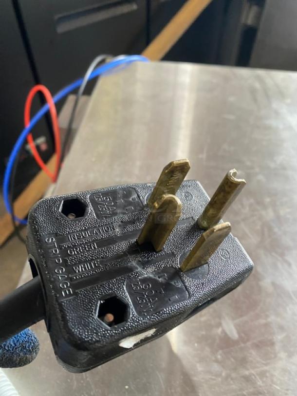 Close-up of the plug for a Hobart Advansys LXe Series dishwasher, model LXER, showing electrical prongs.