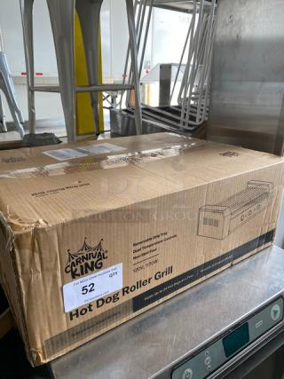 Carnival King 24-Count Hot Dog Roller Grill in box. Features dual temperature controls, 120V, stainless steel, new condition.